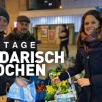Frauen und Männer mit Lebensmittel im Rahmen des sozialen Projektes solidarisch Kochen in der ada kantine